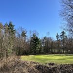 Panoramic view of a lush green golf course at Stonegate Community and Golf Club. Smooth