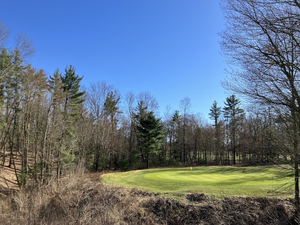 Panoramic view of a lush green golf course at Stonegate Community and Golf Club. Smooth