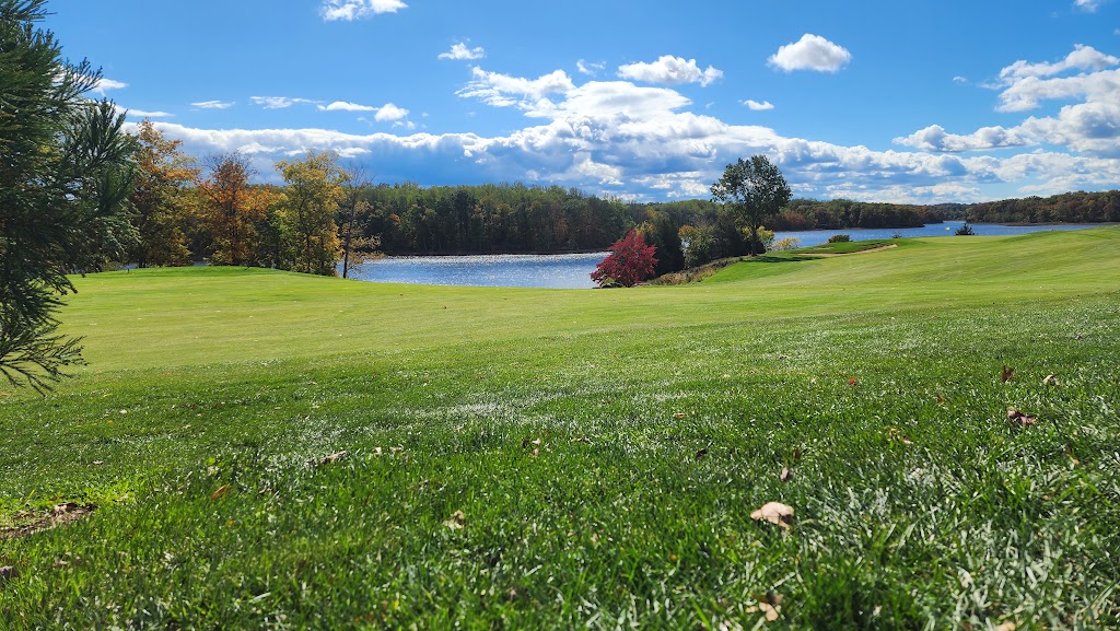 Panoramic view of a lush green golf course at Stonewall Golf Club. Smooth