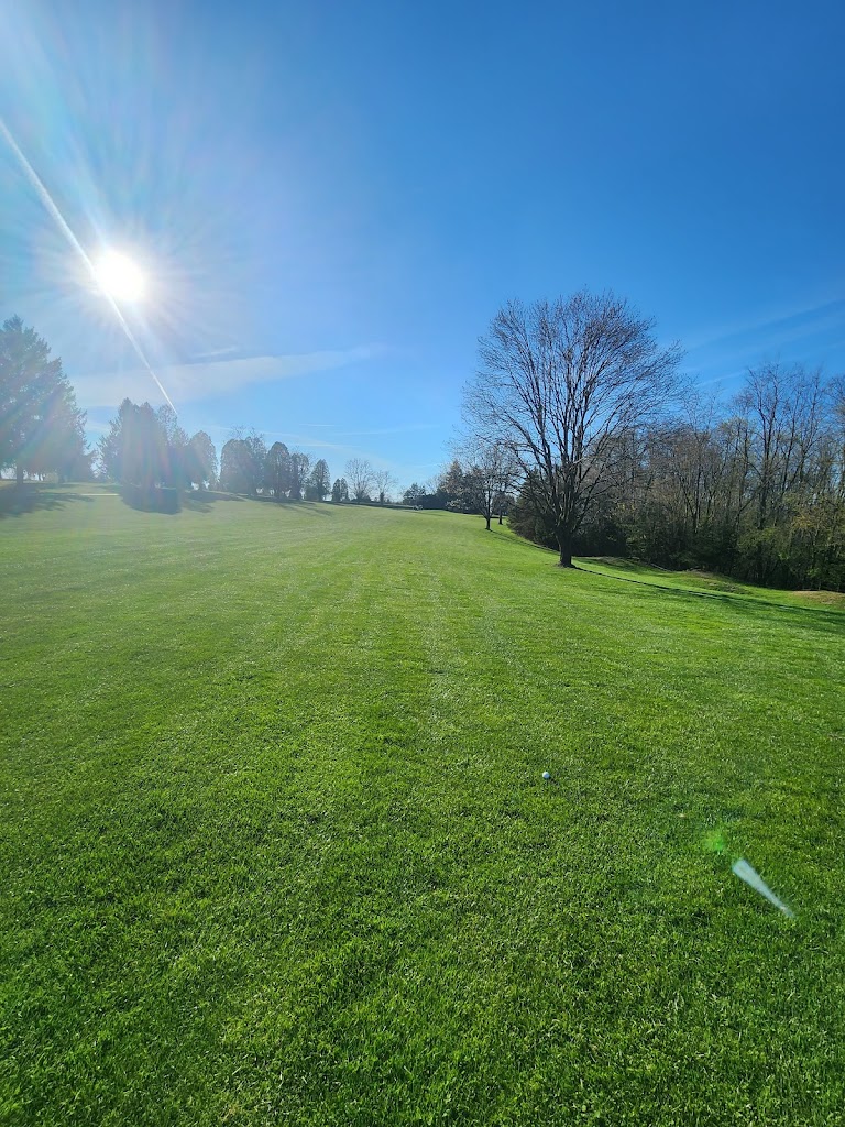 Panoramic view of a lush green golf course at Stoughton Acres Golf Course. Smooth