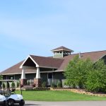 Panoramic view of a lush green golf course at Straight River Golf Course. Smooth