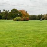 Panoramic view of a lush green golf course at Strawberry Valley Golf Course. Smooth