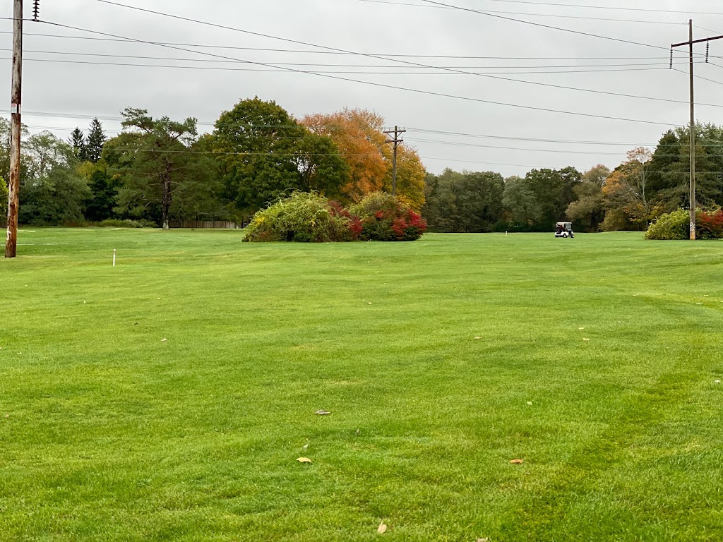 Panoramic view of a lush green golf course at Strawberry Valley Golf Course. Smooth