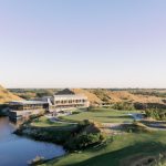 Panoramic view of a lush green golf course at Streamsong Golf Resort. Smooth