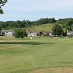 green grass with the flag in the hole.