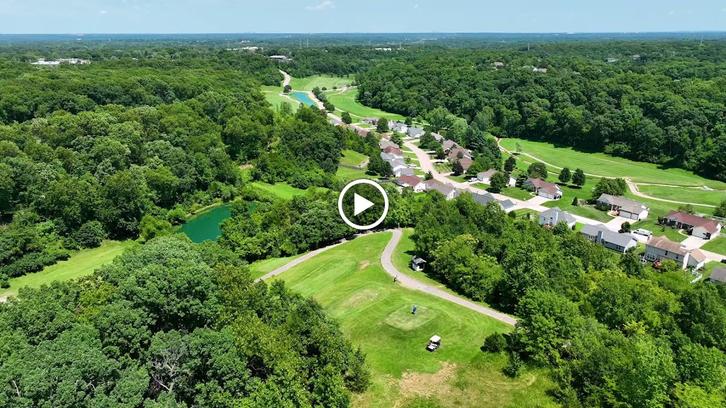 Panoramic view of a lush green golf course at Sugar Creek Golf Course & Banquet Center. Smooth