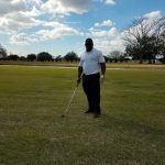 green grass with the flag in the hole.