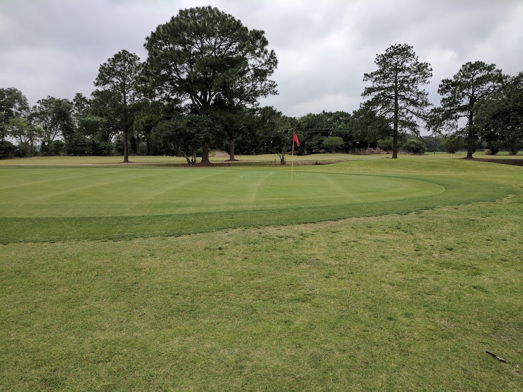 Panoramic view of a lush green golf course at Sugar Oaks Golf Course. Smooth