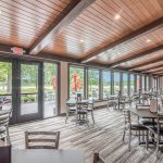 Panoramic view of a lush green golf course at Sugarbush Golf Club & Banquet Center. Smooth