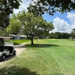 Panoramic view of a lush green golf course at Summertree Golf Club. Smooth