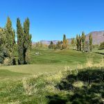 Panoramic view of a lush green golf course at Sun Hills Golf Course. Smooth