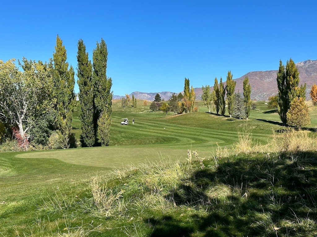 Panoramic view of a lush green golf course at Sun Hills Golf Course. Smooth