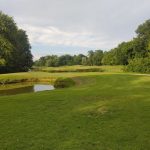 Panoramic view of a lush green golf course at Sun Valley Golf Course. Smooth