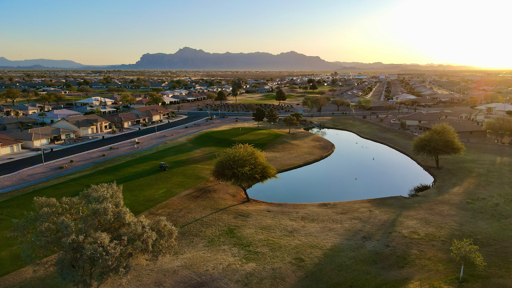 Panoramic view of a lush green golf course at Sunland Springs Golf Club. Smooth