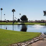 Panoramic view of a lush green golf course at Sunland Village Golf Club. Smooth