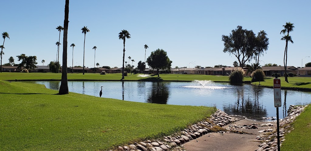 Panoramic view of a lush green golf course at Sunland Village Golf Club. Smooth