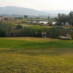 Panoramic view of a lush green golf course at Sunridge Golf and Recreations. Smooth