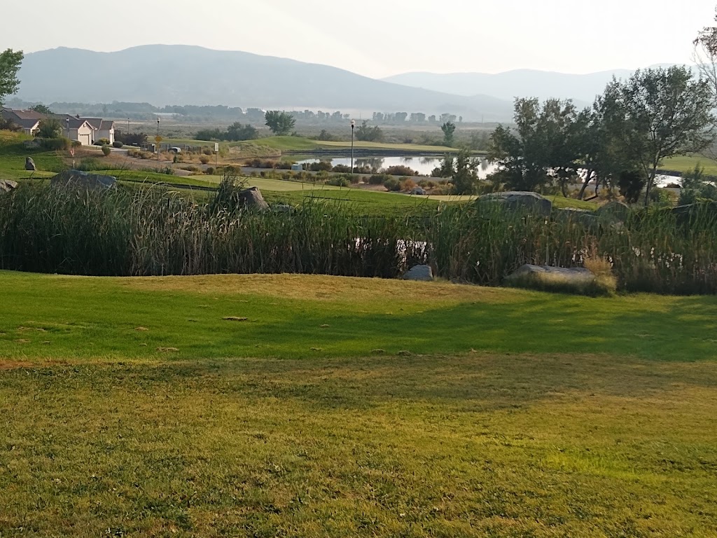 Panoramic view of a lush green golf course at Sunridge Golf and Recreations. Smooth