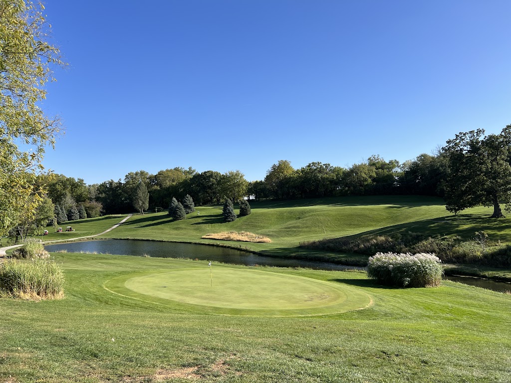 Panoramic view of a lush green golf course at Sunrise Golf. Smooth