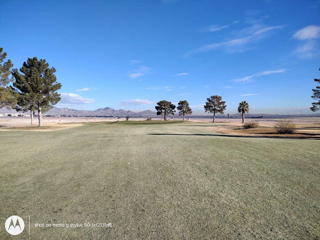 Panoramic view of a lush green golf course at Sunrise Vista Golf Course. Smooth