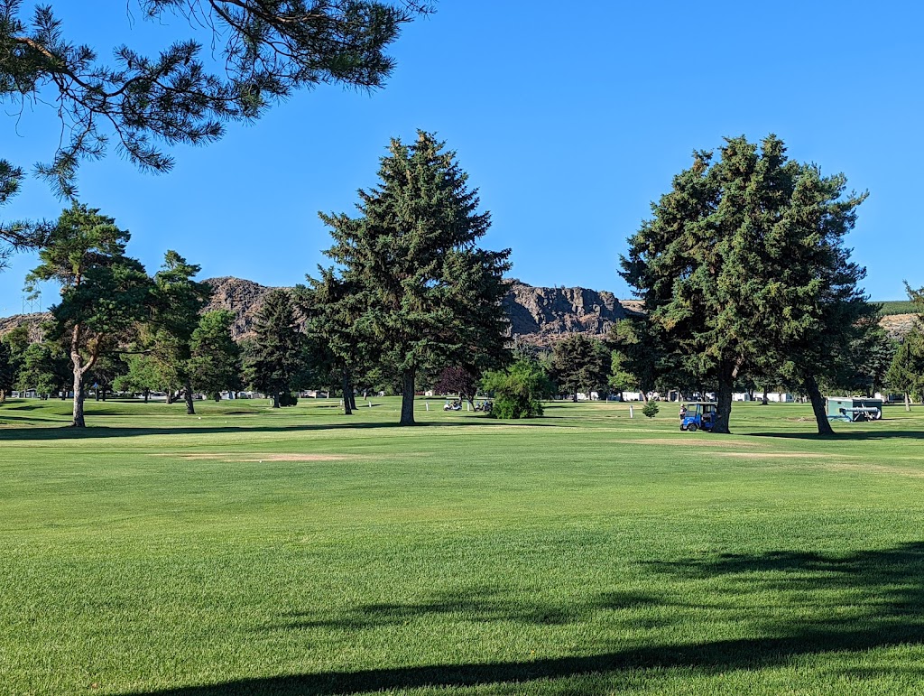 Panoramic view of a lush green golf course at Suntides Golf Course. Smooth