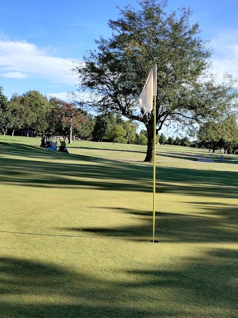 Panoramic view of a lush green golf course at Surrey Hills Golf Club. Smooth