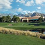 Panoramic view of a lush green golf course at TPC Summerlin. Smooth