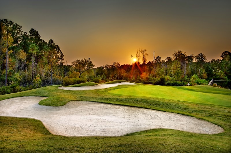 Panoramic view of a lush green golf course at Talamore Golf Resort. Smooth