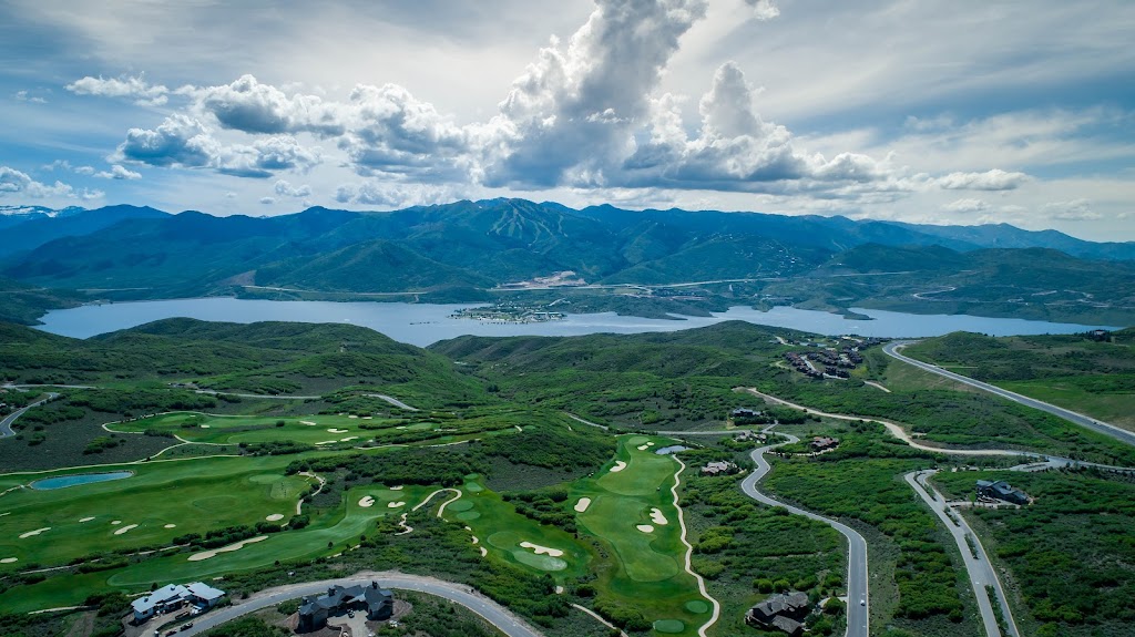 Panoramic view of a lush green golf course at Talisker Club. Smooth