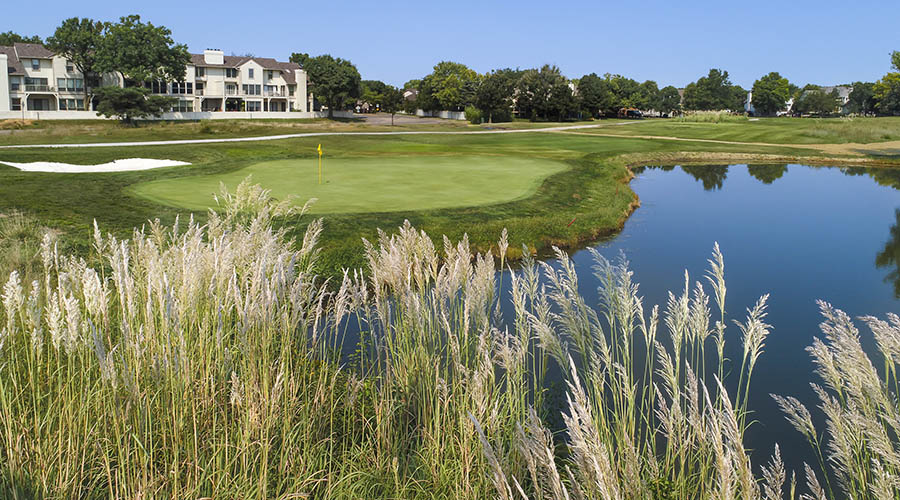 Panoramic view of a lush green golf course at Tallgrass Golf Club. Smooth