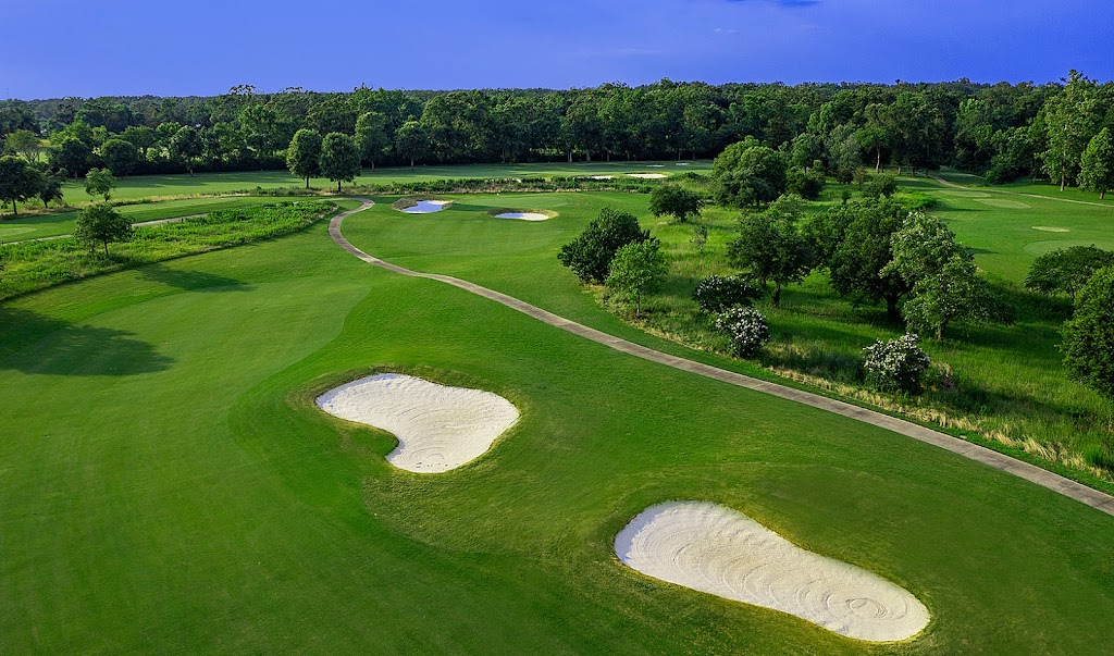 Panoramic view of a lush green golf course at Tamahka Trails Golf Course. Smooth