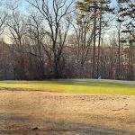 Panoramic view of a lush green golf course at Tanglewood Park Golf. Smooth