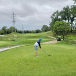 green grass with the flag in the hole.