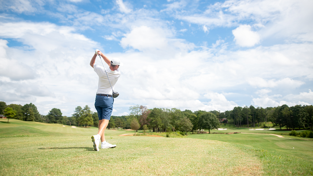 Panoramic view of a lush green golf course at Tempest Golf Club. Smooth