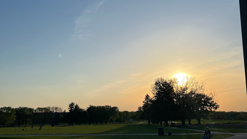 Panoramic view of a lush green golf course at Terrace Hills Golf Course. Smooth