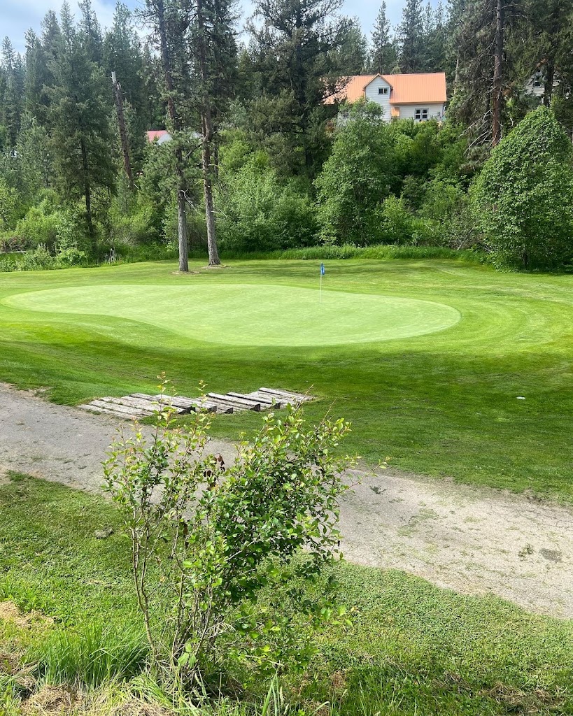 Panoramic view of a lush green golf course at Terrace Lakes Resort. Smooth