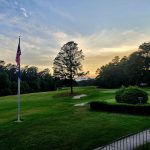 Panoramic view of a lush green golf course at The Aiken Golf Club. Smooth