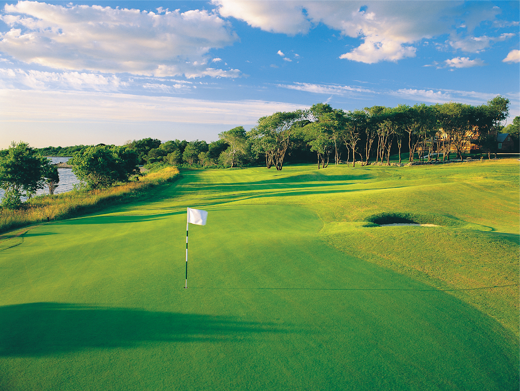 green grass with the flag in the hole.