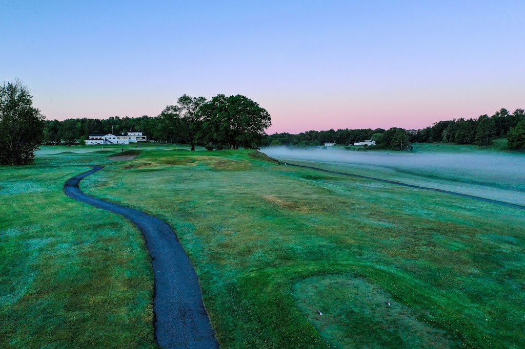 Panoramic view of a lush green golf course at The Bath Golf Club. Smooth