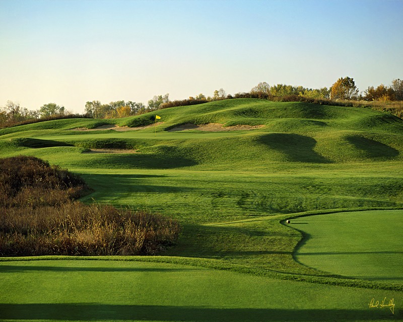 Panoramic view of a lush green golf course at The Bog. Smooth