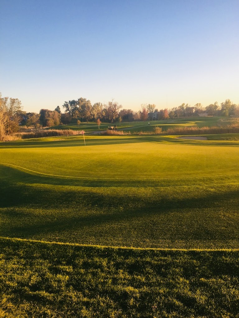 Panoramic view of a lush green golf course at The Bridges at Beresford Golf Course and Community Center. Smooth