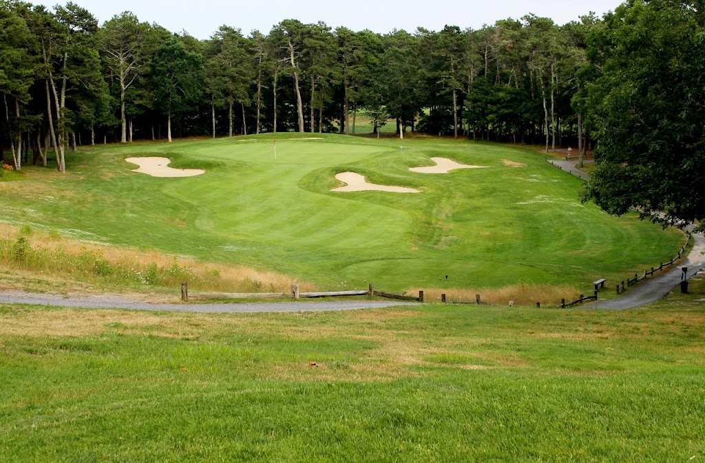 Panoramic view of a lush green golf course at The Captains Golf Course. Smooth