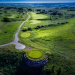 Panoramic view of a lush green golf course at The Club At Pradera. Smooth