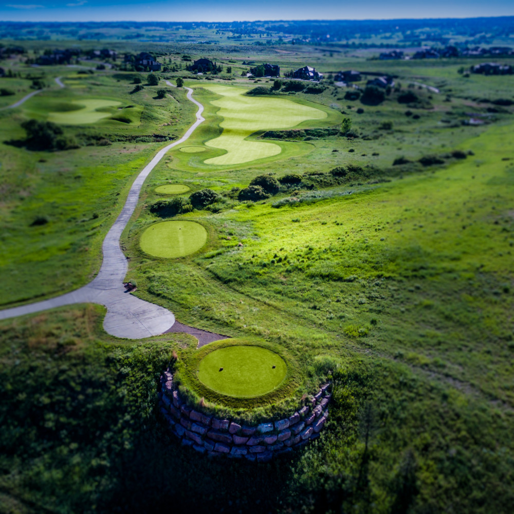 Panoramic view of a lush green golf course at The Club At Pradera. Smooth