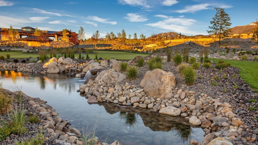 Panoramic view of a lush green golf course at The Club at ArrowCreek. Smooth