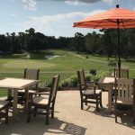 Panoramic view of a lush green golf course at The Club at Diamondhead. Smooth