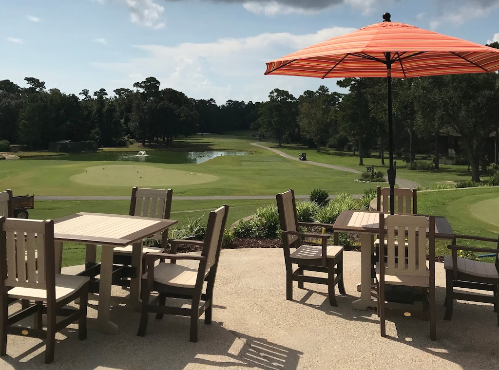 Panoramic view of a lush green golf course at The Club at Diamondhead. Smooth