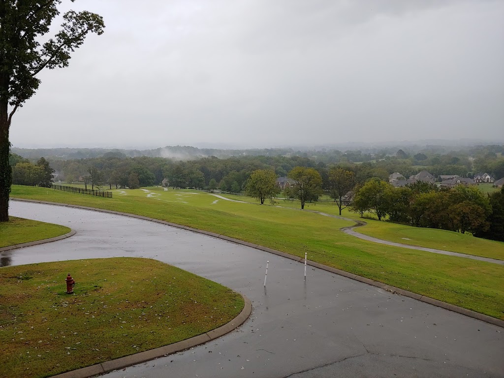 Panoramic view of a lush green golf course at The Club at Five Oaks. Smooth