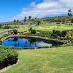 Panoramic view of a lush green golf course at The Club at Hokuli`a. Smooth