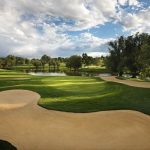 Panoramic view of a lush green golf course at The Club at Inverness. Smooth